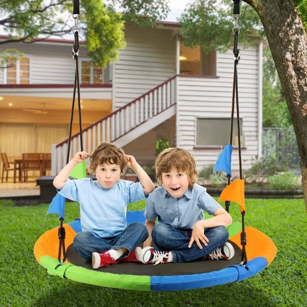 A one metre round saucer swing hanging from a tree